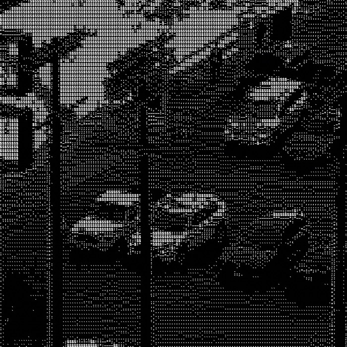 ASCII iOS Camera output. A row of cars in a dense ramp, reflections reading as brightness steps across the grid.
