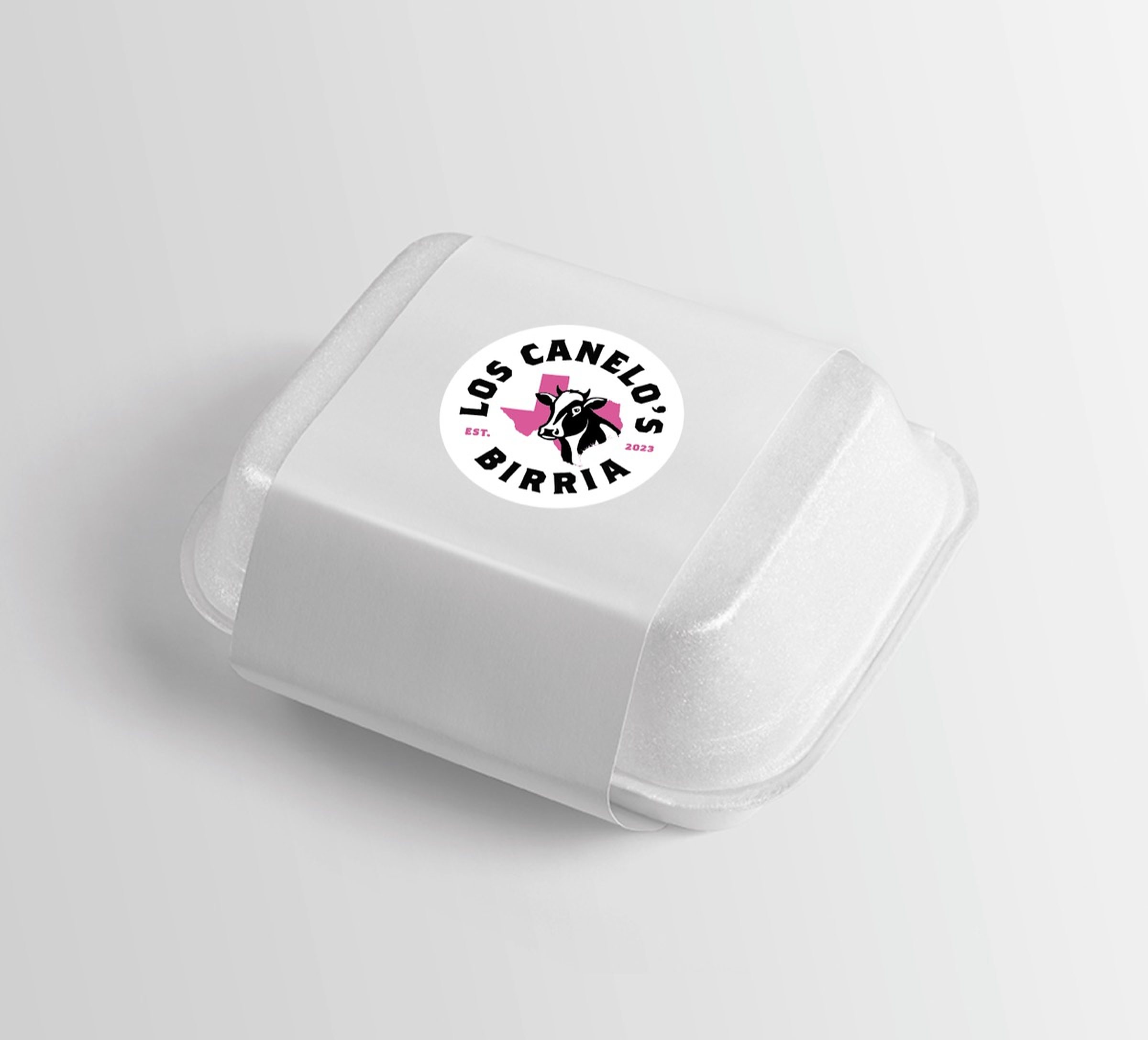 The mark applied as a round label on a white foam takeout container.